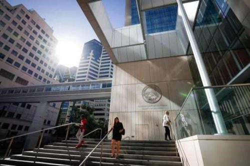 People exit and enter the San Diego Central Courthouse on Wednesday, Oct. 23, 2024 in San Diego, CA.