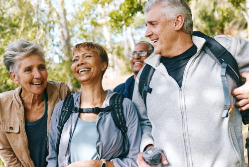 Selfie, nature and mature people hiking for fitness, health and wellness on mountain for travel. Happy, activity and senior friends with photography picture for memory on trekking trip or vacation.